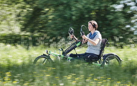 Woman riding a handbike in the country