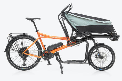 photo of the HASE PINO CARGO hybrid tandem and cargo bike with the porter back in front, viewed from the side.